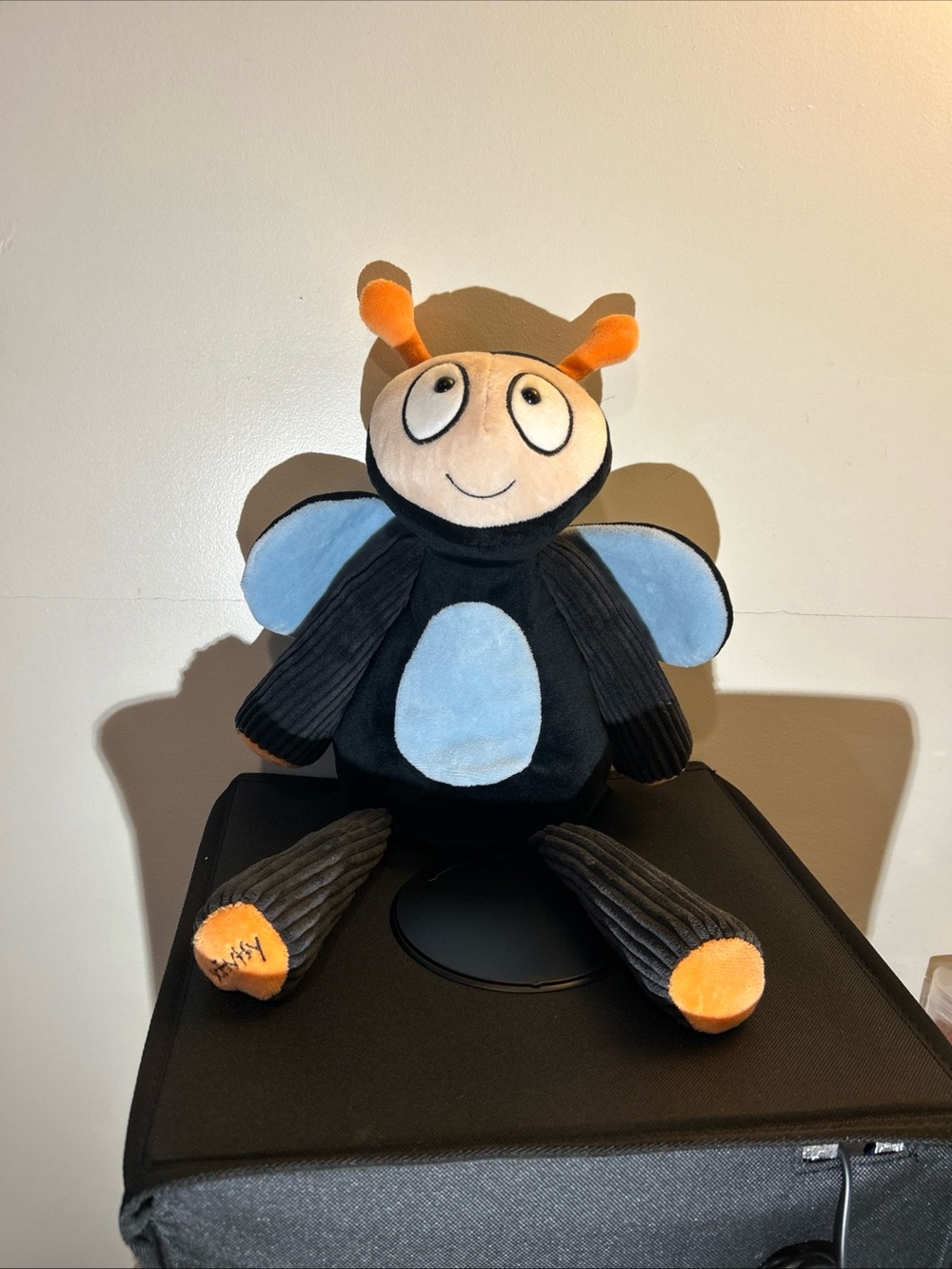 Scentsy Black Plush Bug with Blue Patches and Orange Accents